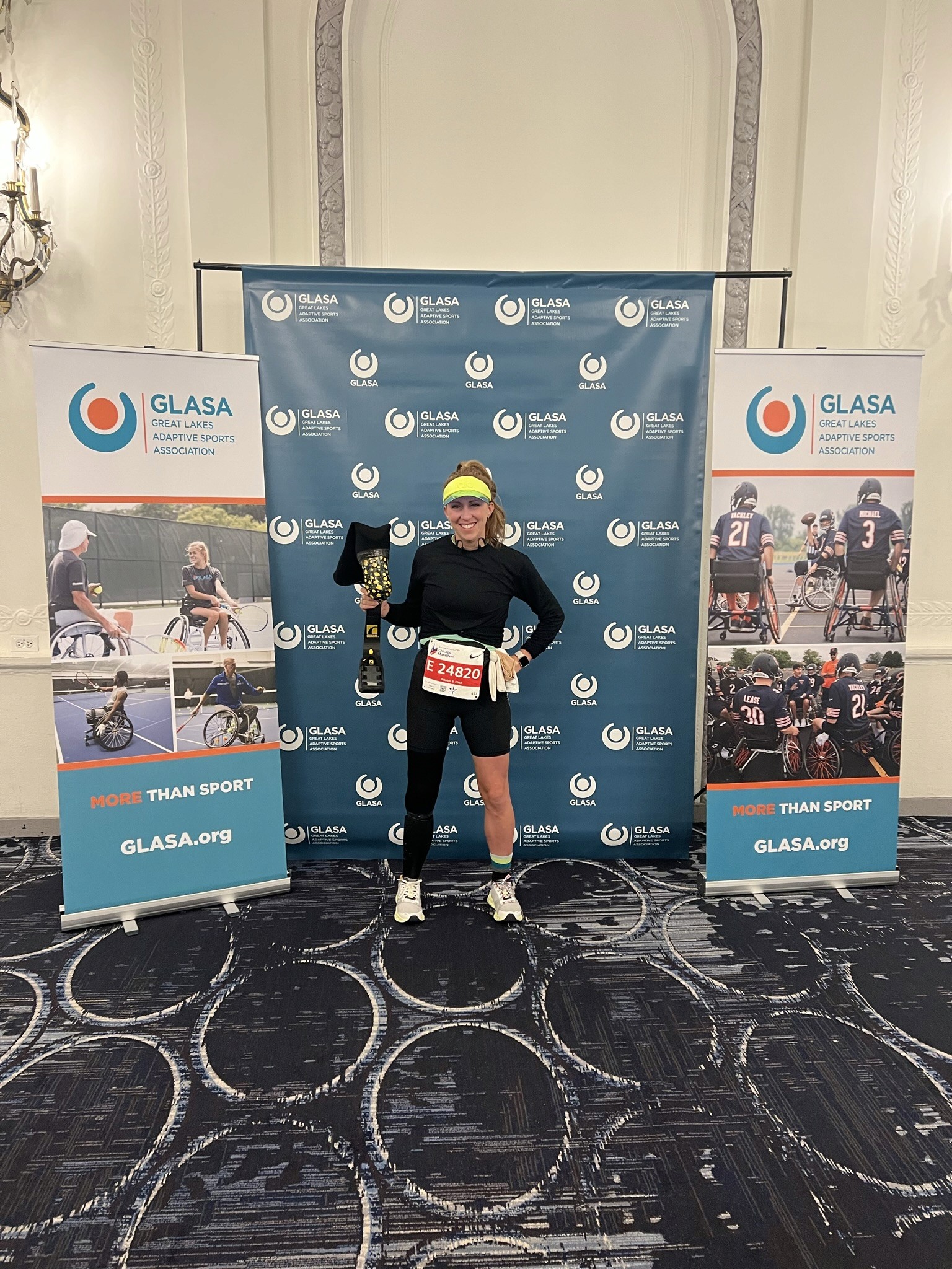 10:43 am – My one and only "leg stop" during the Chicago Marathon—mile 15, right at Charity Mile, where our amazing family was waiting with my gear. Pictured here is Gordon proudly holding up my running blade as I swapped out silicone liners. With a quick kiss to the kids, I smiled and said, "See you in 11 miles!"